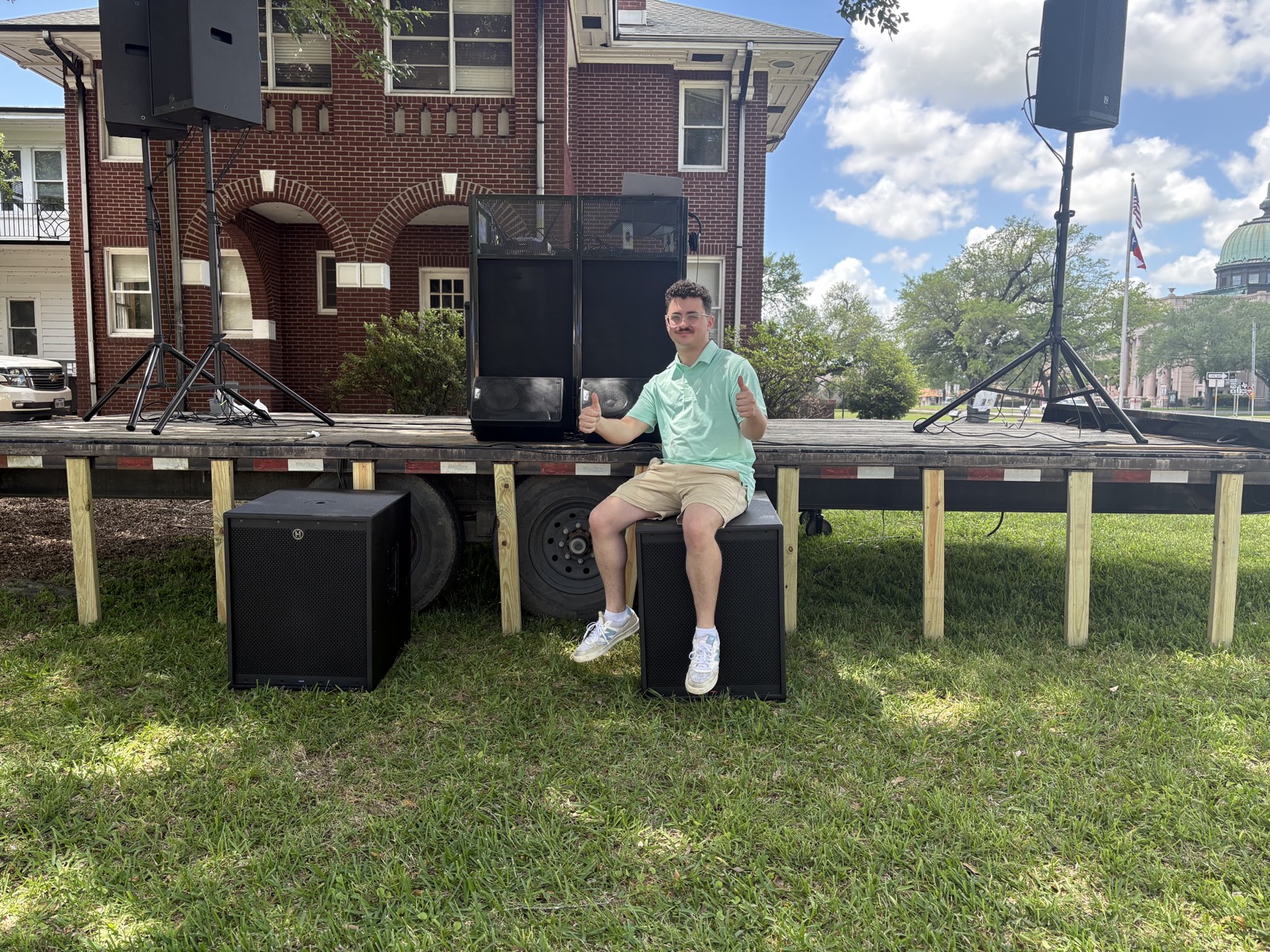 Bryce LeDuc, founder of DJ BOT, with professional DJ sound setup at an outdoor event